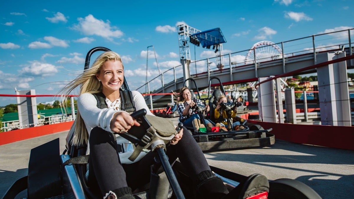 Kids riding Go-Karts at The Track Family Fun Parks. - Branson, Missouri, USA